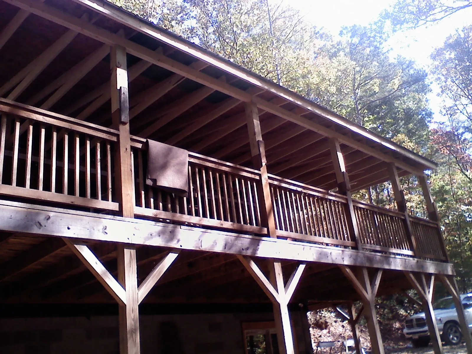 Timber framing under a new elevated porch and deck — Roof Leak Repair in Dwight by Roofing Brothers